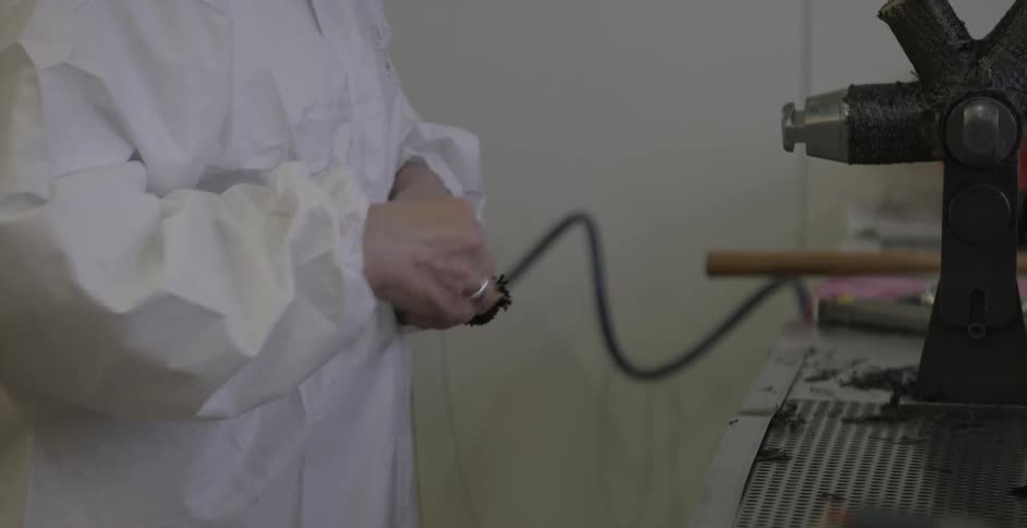 A factory employee works in assembly