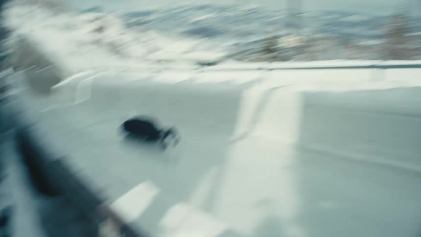 A clip of a person sliding through the ice tunnel