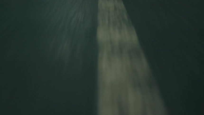 Going really fast down the middle of a road