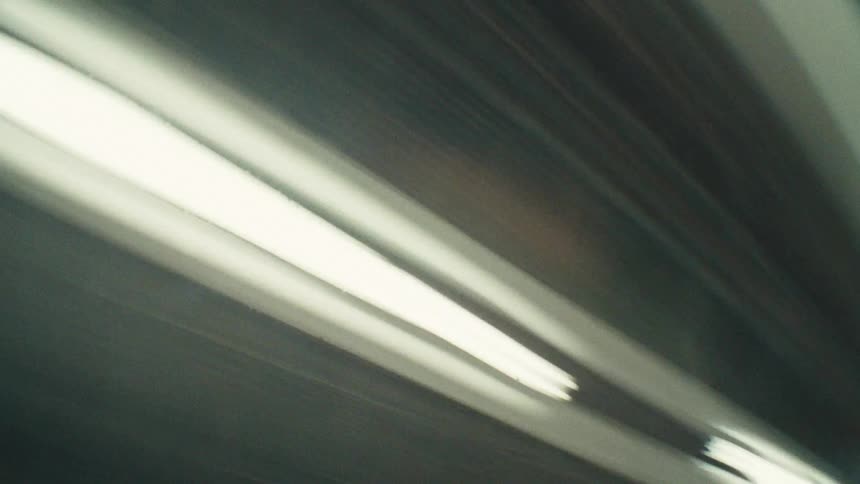 The lights pass by on the ceiling