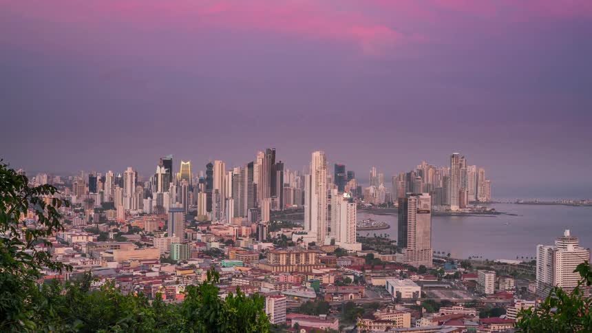 A blip clip of a city during day and night