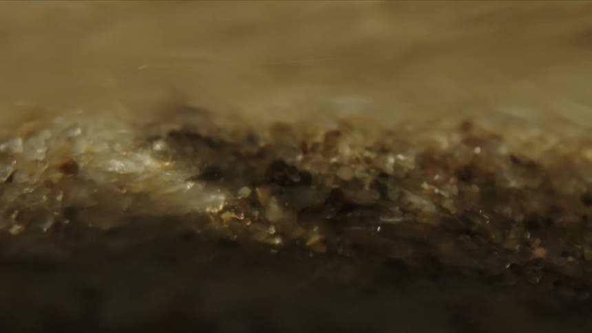 Water flows over the sand fast