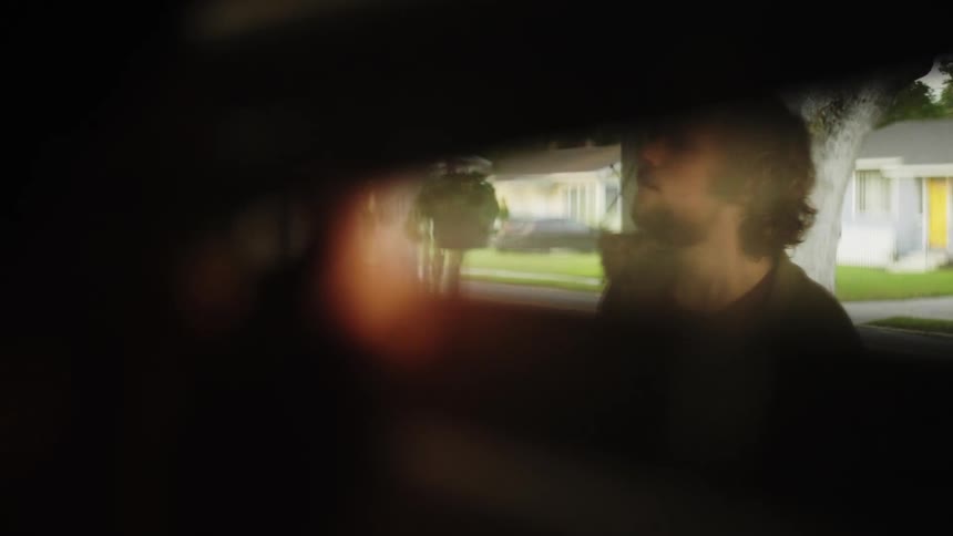 A clip of a person peeping through the window