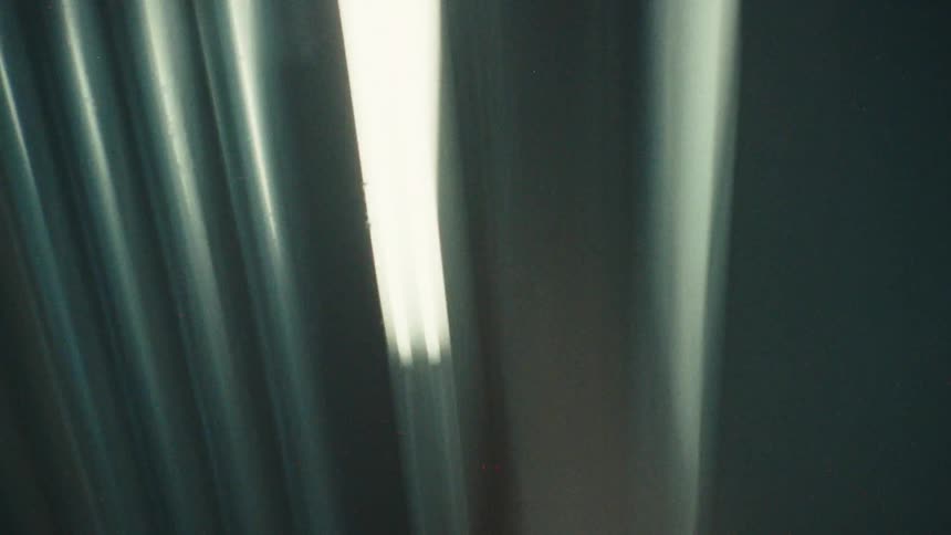 Moving view of a ceiling with lights on