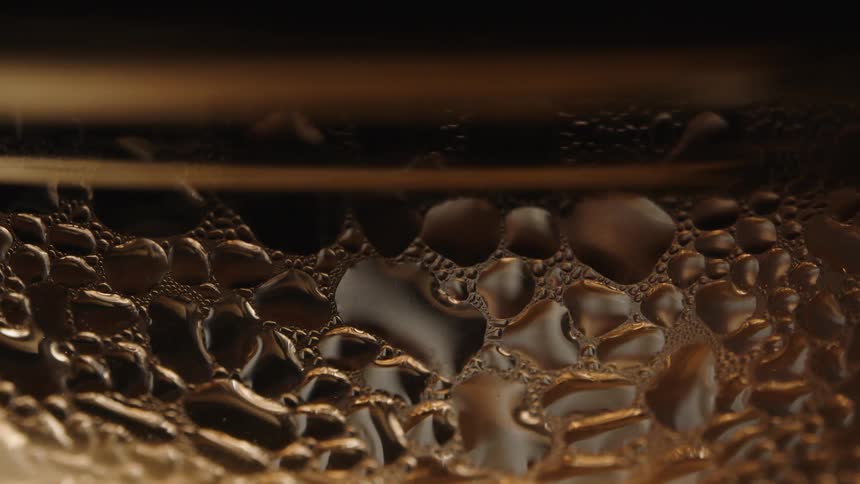 Closeup of a glass structure with abstract texture and shadow play