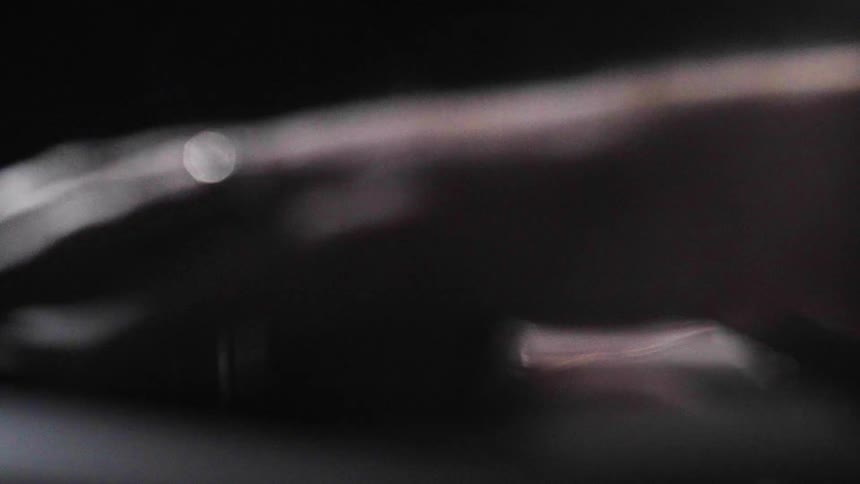 Pair of hands interacting with a music mixer
