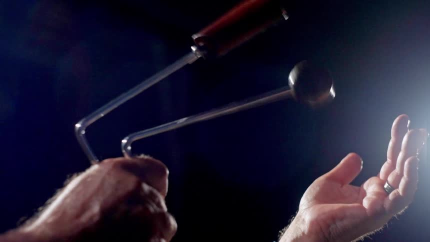Pair of hands interacting with a musical instrument