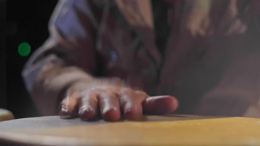 A close up footage of a person drumming