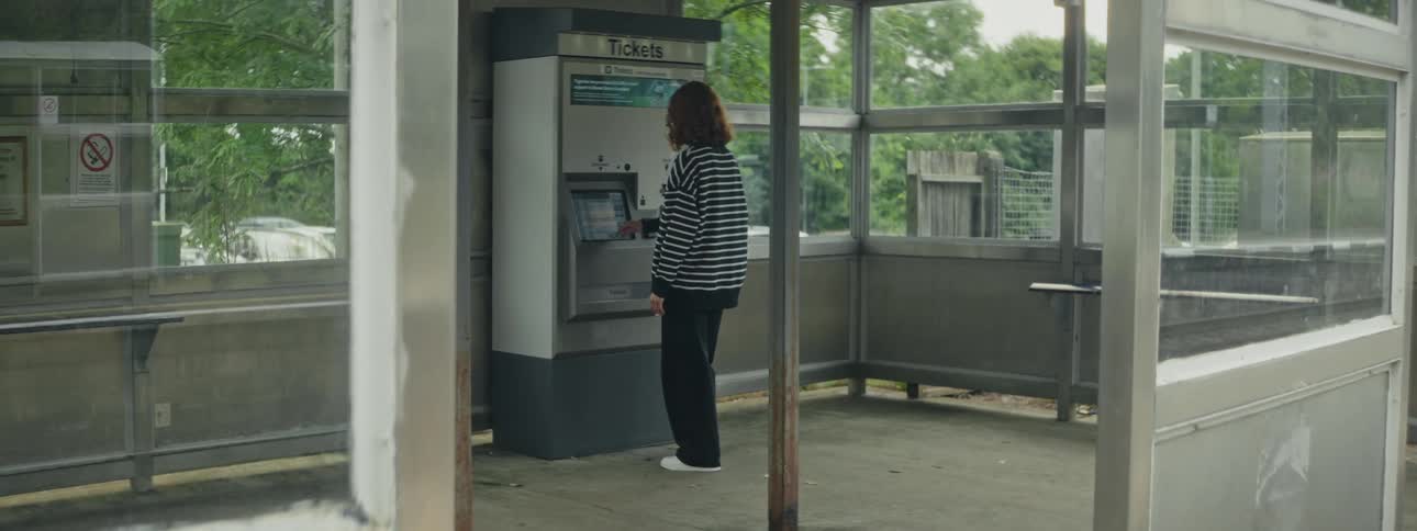A close up clip of a person operating a cash machine