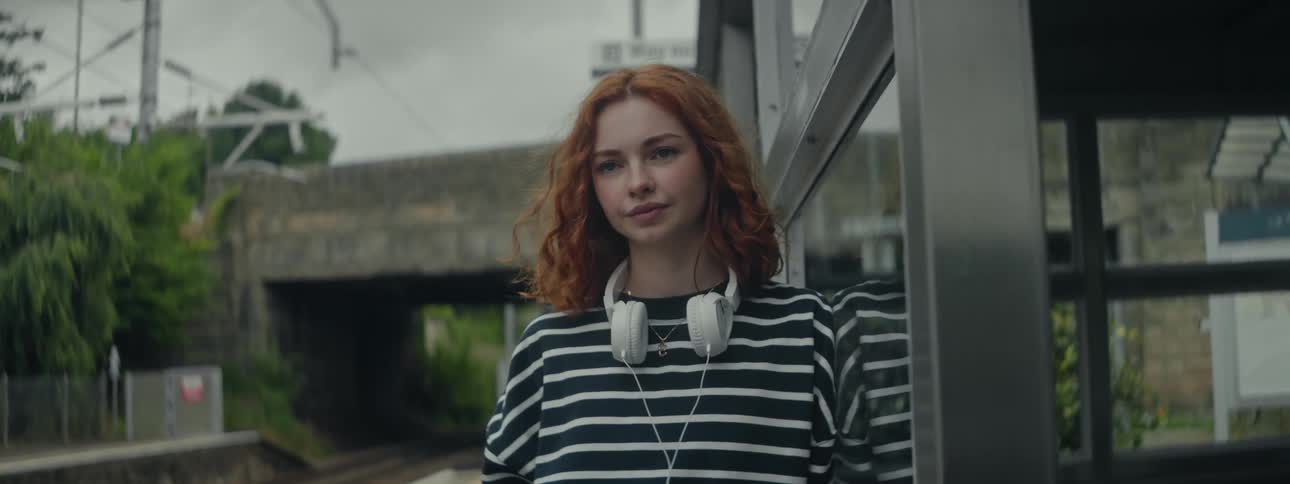 A clip of a lady standing at the terminal