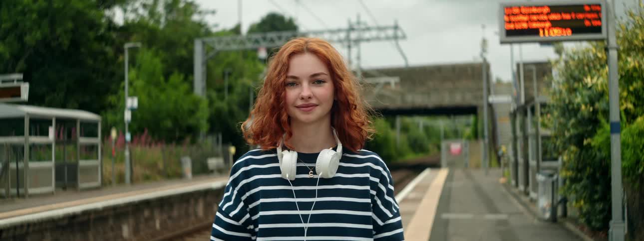 Portrait of a young woman in an outdoor metro station area