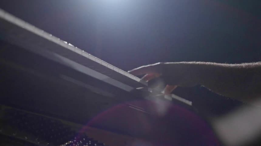 Arms of a man playing the piano
