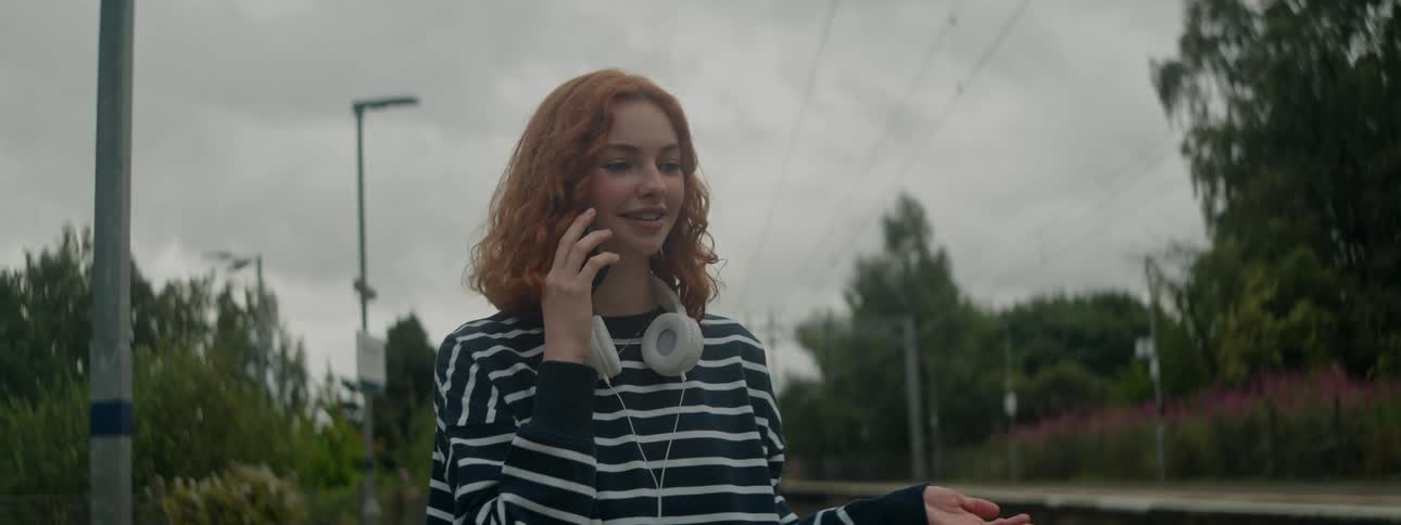 A woman talks on her cell phone