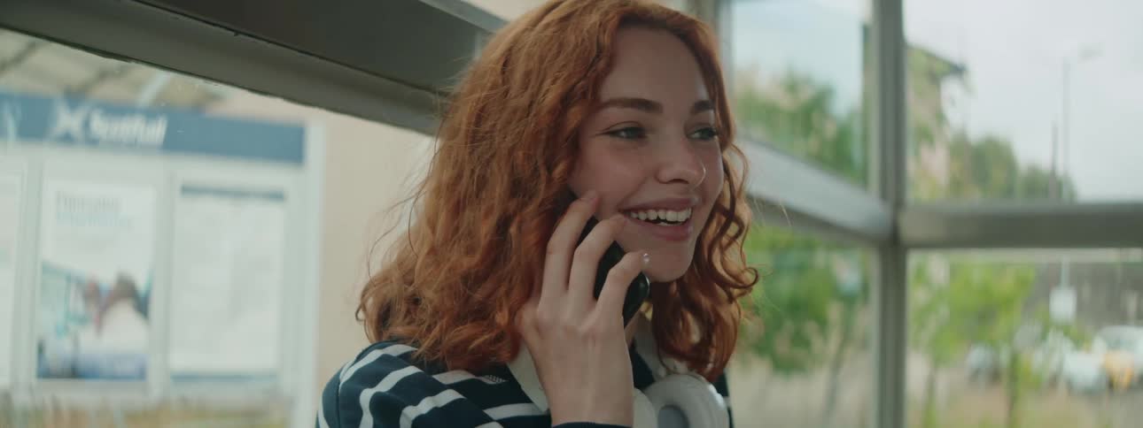 A clip of a lady on a phone call