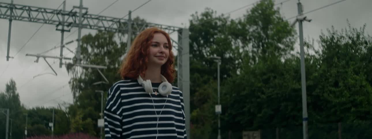 A clip of a lady walking and smiling
