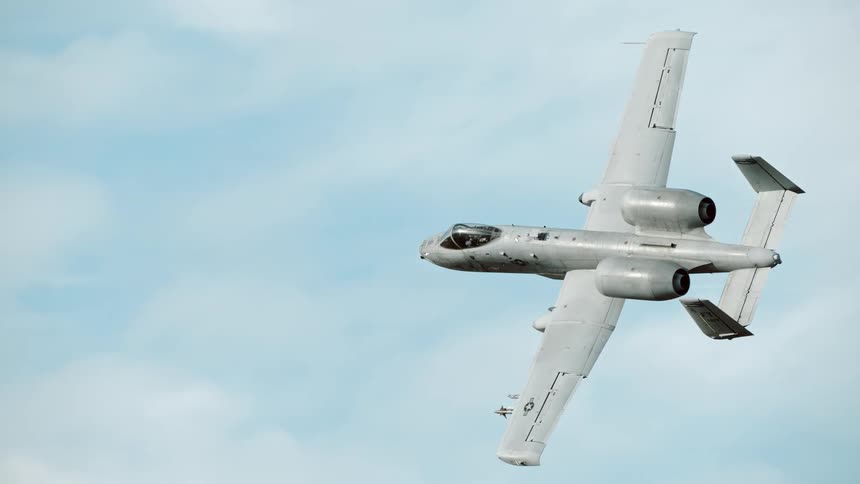 An a 10 thunderbolt ii warplane soars through the sky its twin engines and distinctive wing design visible