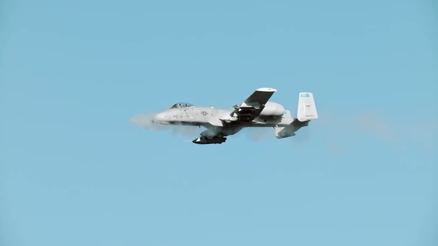 A bomber passes a cloud in the sky