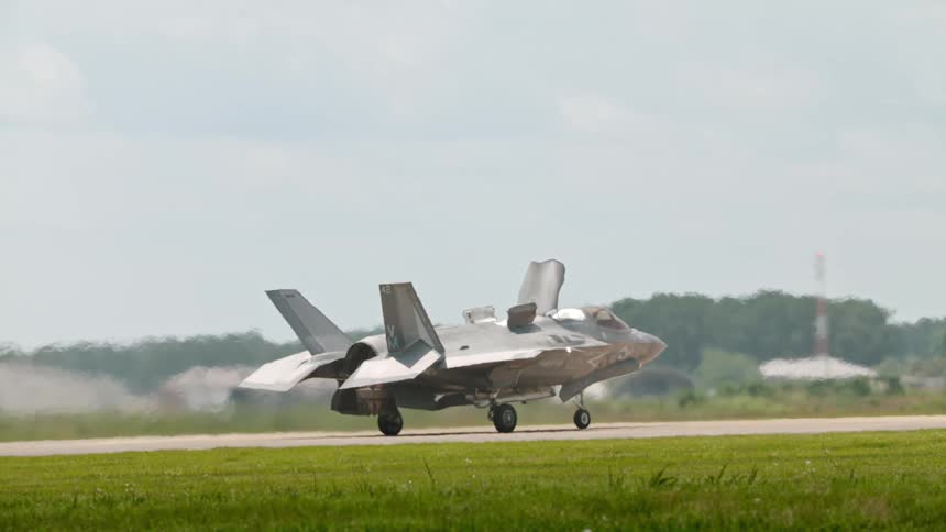 Military fighter jet posing on the runway