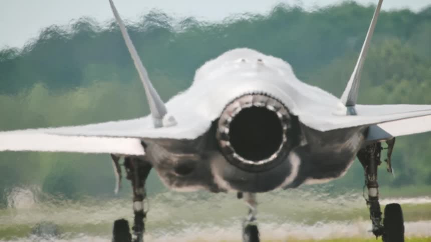 A jet turns on the runway during takeoff