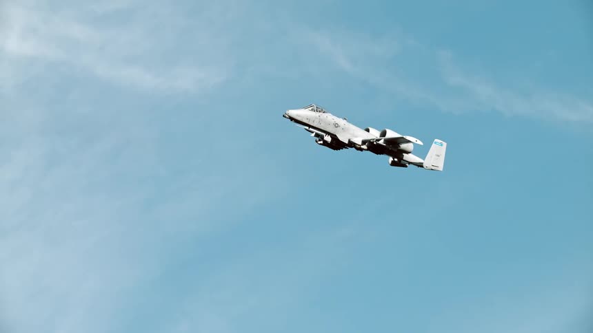 A bomber glides high in the sky