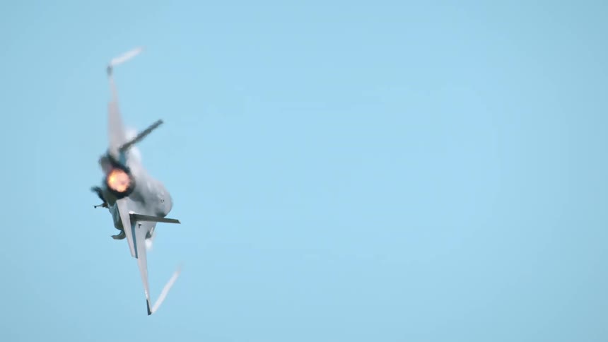 A jet flies in the clear sky