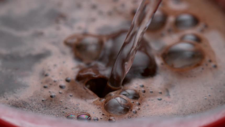 Water is poured into the mug