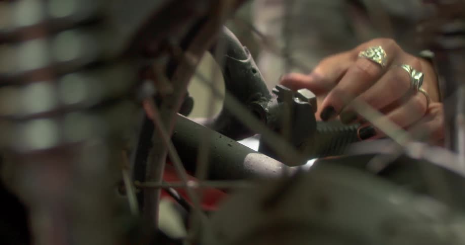 Hand adjusting the piston of a motorcycle
