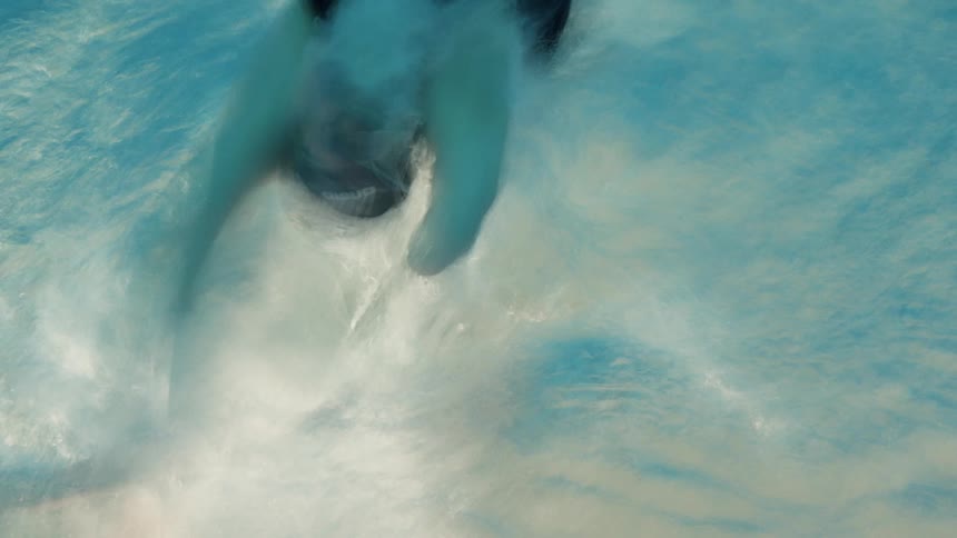 A blurry clip of a person swimming