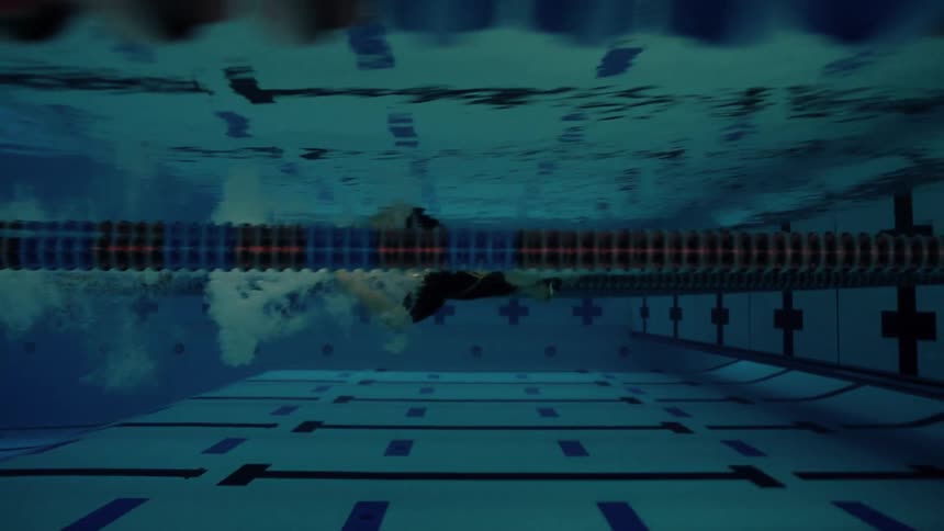 Woman swimming in a swimming pool