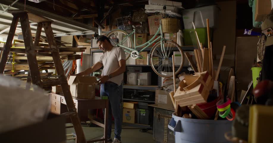 A man removes a disco ball from a box