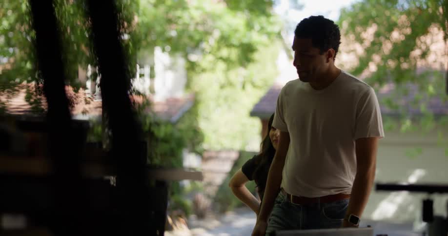 Man and woman entering an establishment