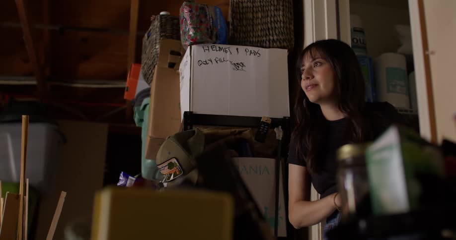 Woman looking at a garage with boxes