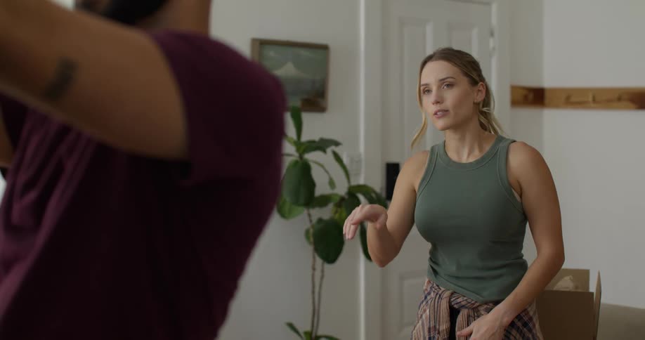 Woman talking and gesturing to a man