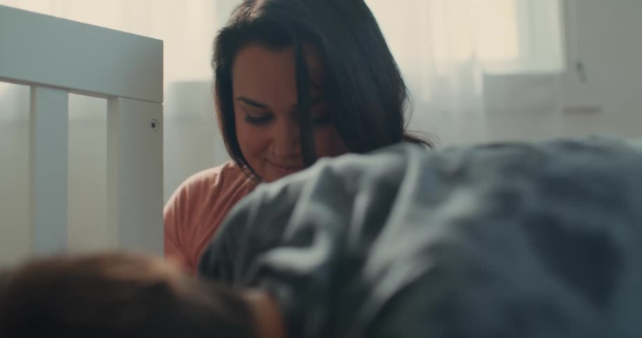 Boy next to his pregnant mother