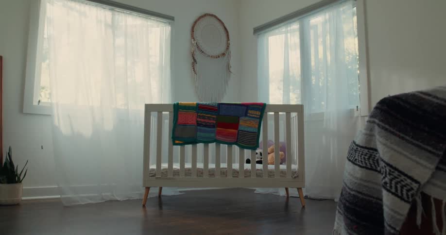 Breeze flowing in through an open window in a babies nursery