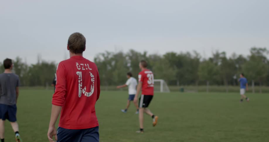 Soccer players are walking on the field