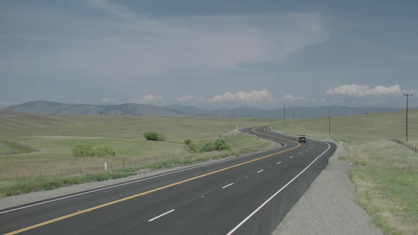 Cars driving on a two lane highway