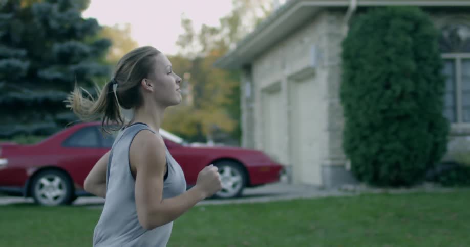 A woman is running outside