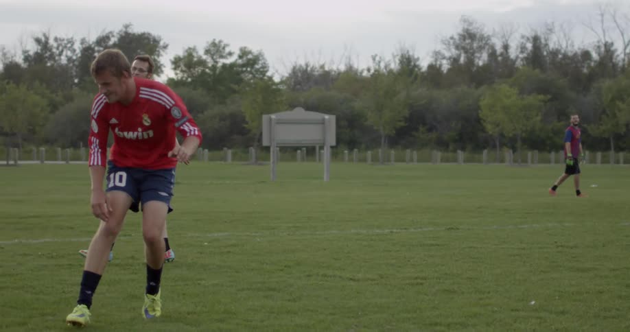 A couple friends playing soccer