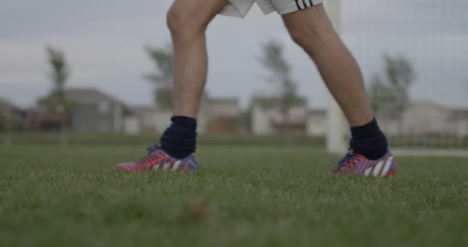 People are walking on a grass field