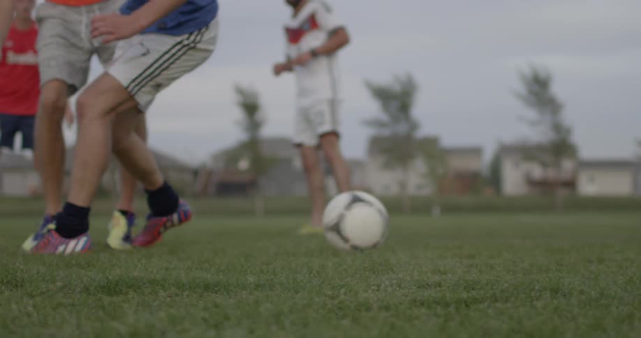 A group of friends are playing with a soccer ball