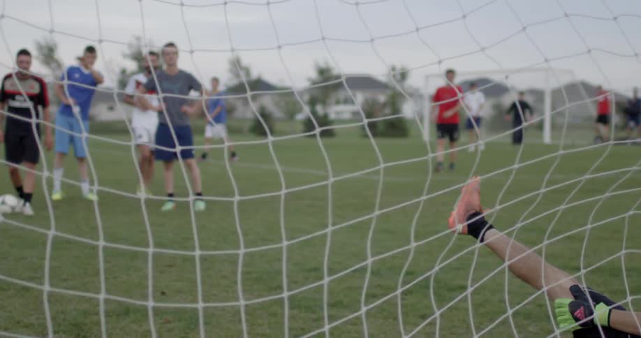A group of people are playing soccer