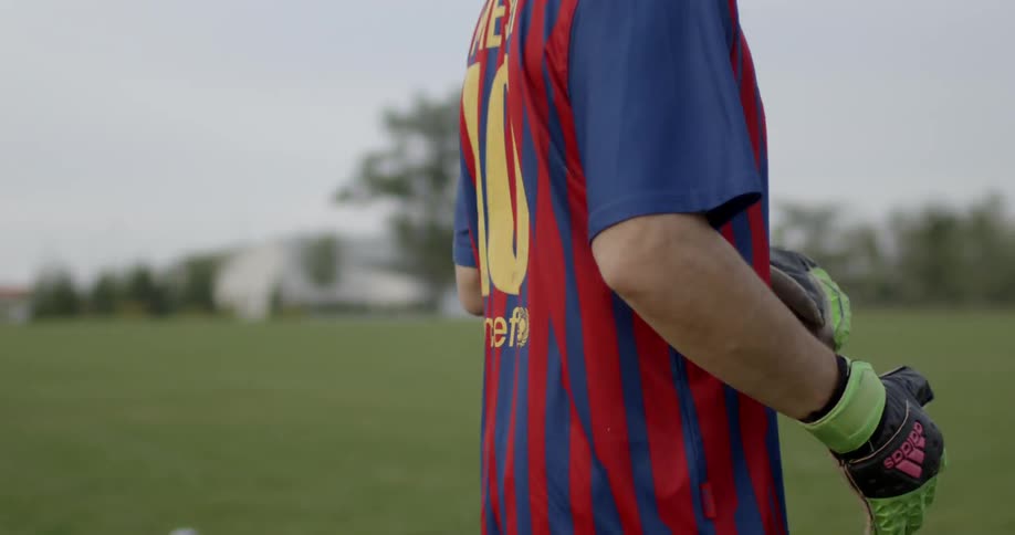 Soccer players run along the green field