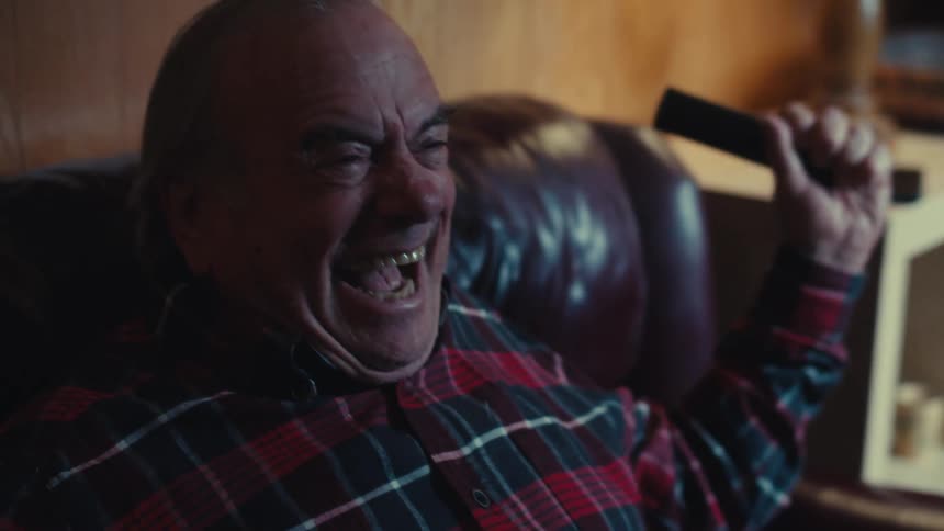 Portrait of a man sitting happily vibrating with his arms up
