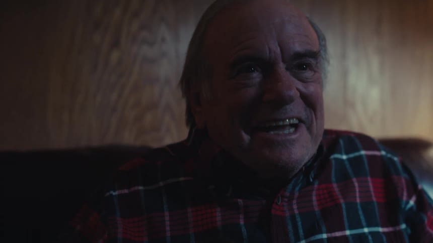 A footage of an elderly man showing a happy reaction