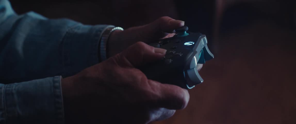 A person is using a controller to play videogames