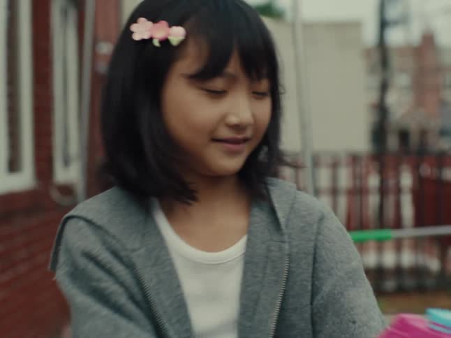 Girl playing with a toy gun