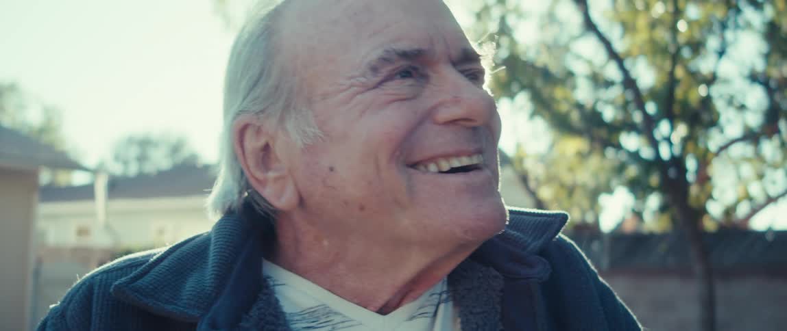 Portrait of a happy elderly man in an outdoor setting