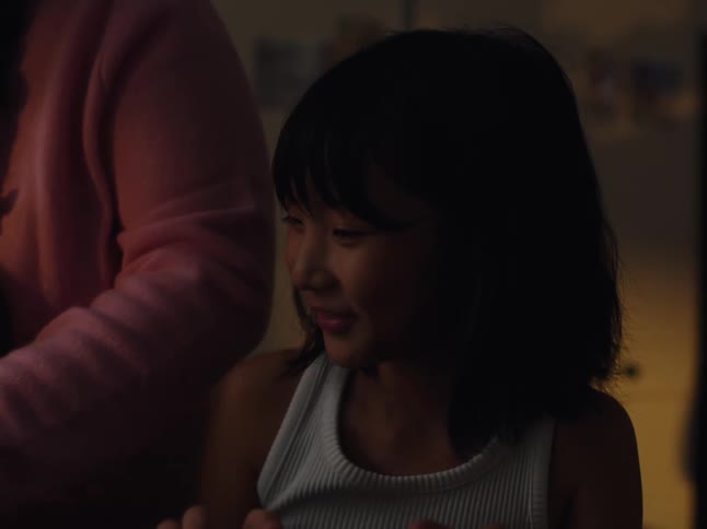 Woman pouring milk from a ceramic bowl and getting desperate and a child next to her laughing