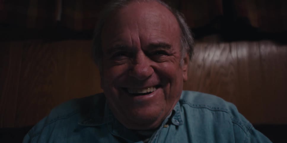 Cheerful man typing on a keyboard